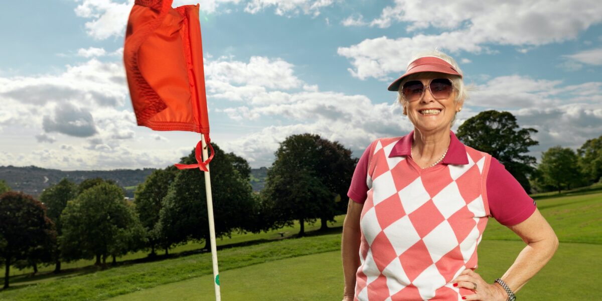 Mature lady playing golf