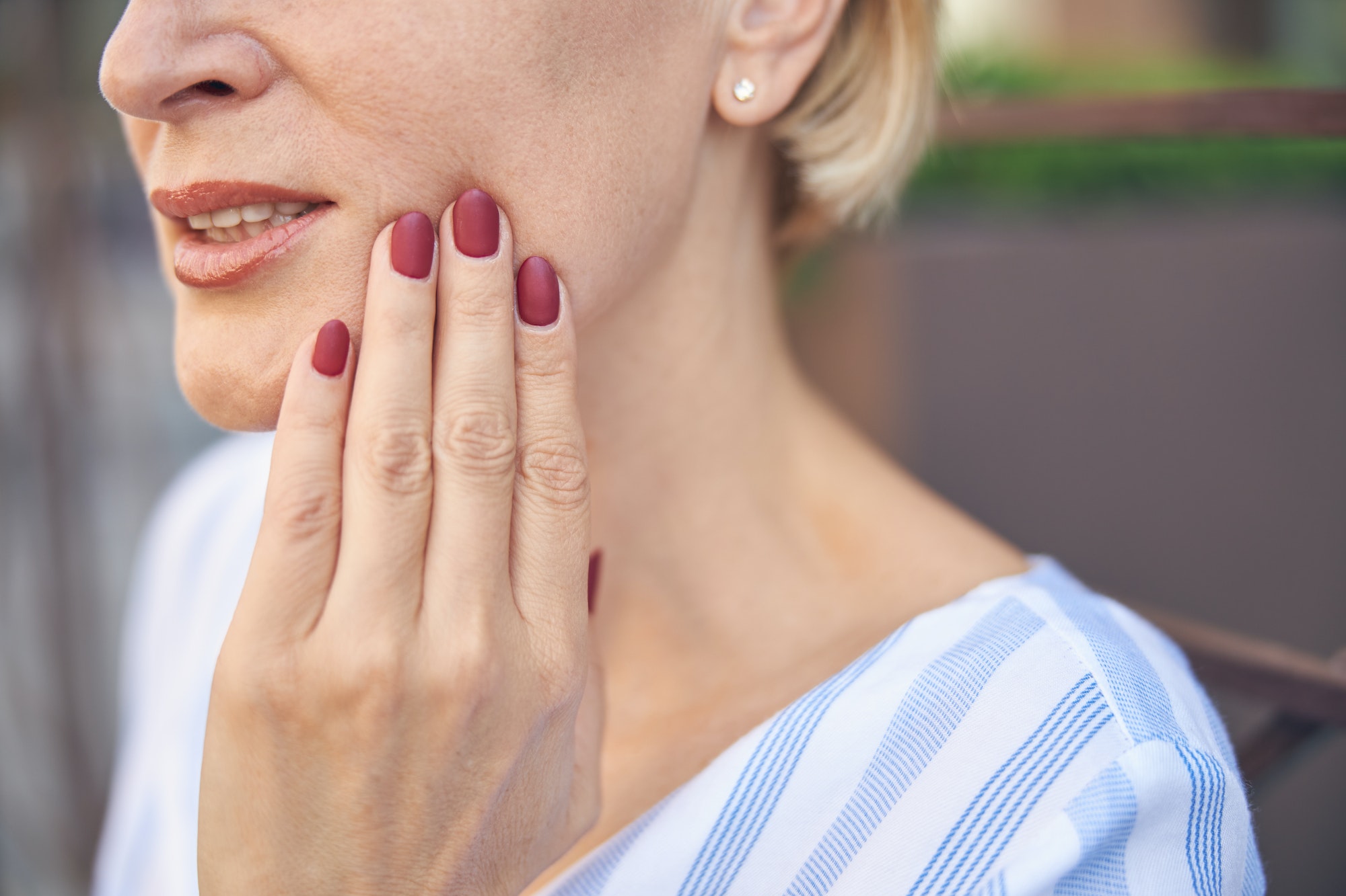 Female suffering from an acute dental pain TranscenDental Smiles is a trusted TMJ/TMD TREATMENT provider