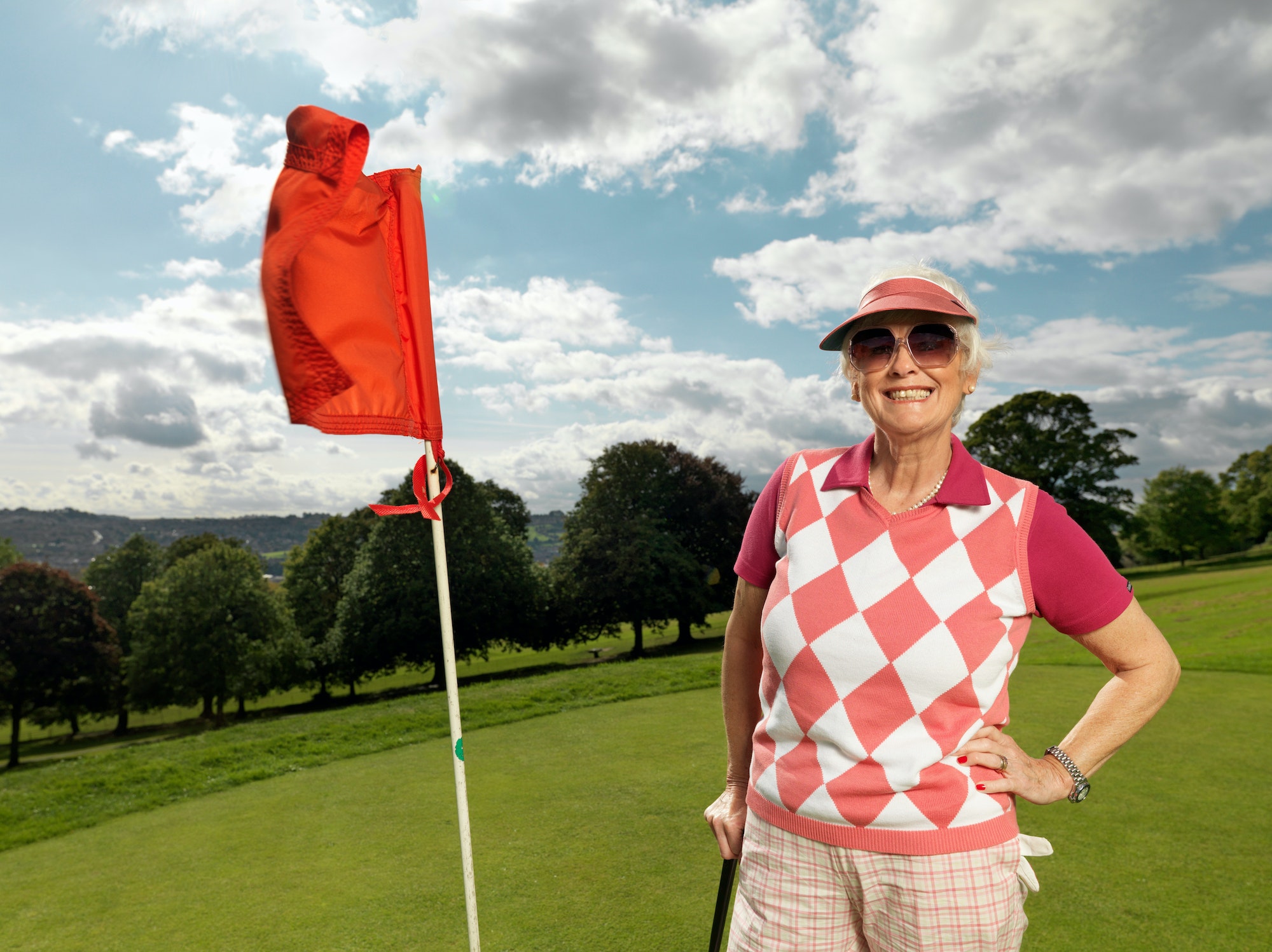 Mature lady playing golf